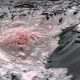 False-color image showing the interior of Occator Crater. The pinkish areas show regions in which exposed brine spilled out onto Ceres’s surface.